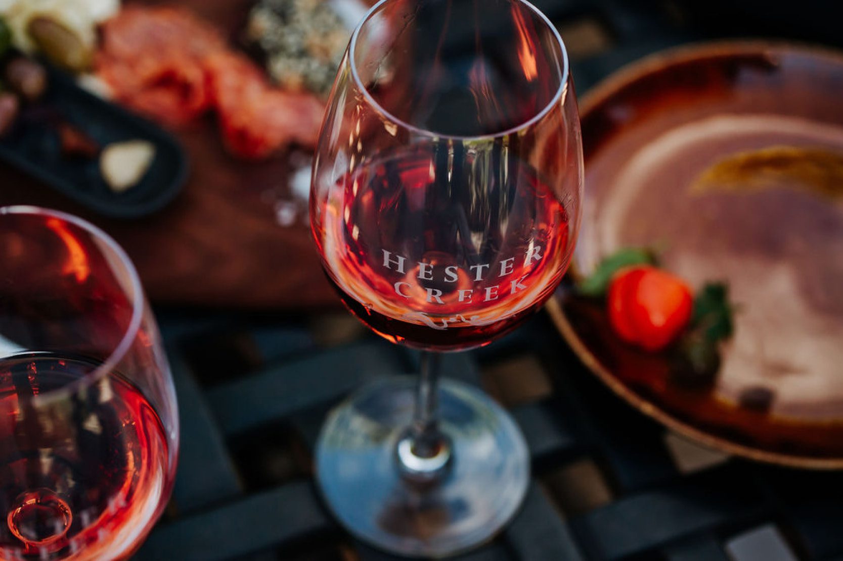 A glass of rose on a picnic table