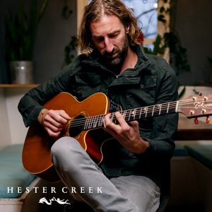Musician playing guitar in the kitchen