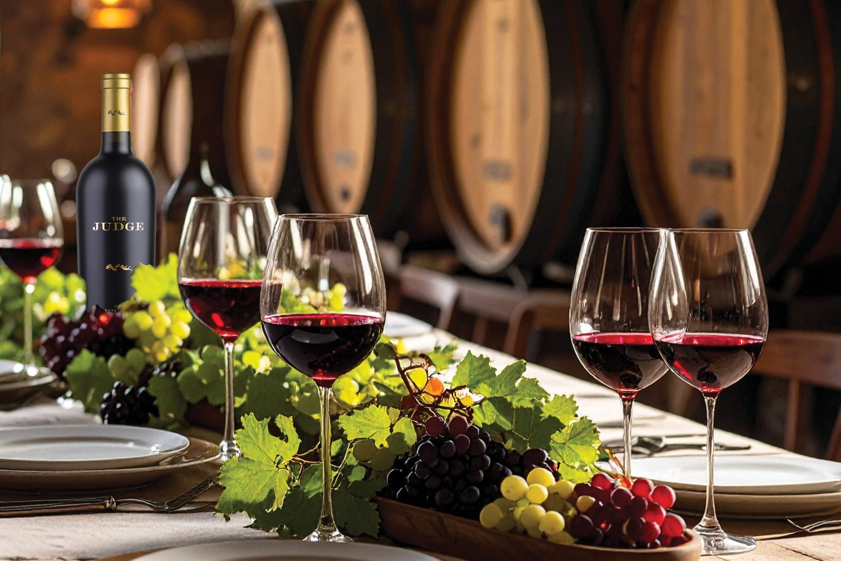 Bottle of Judge on a table with wine glasses